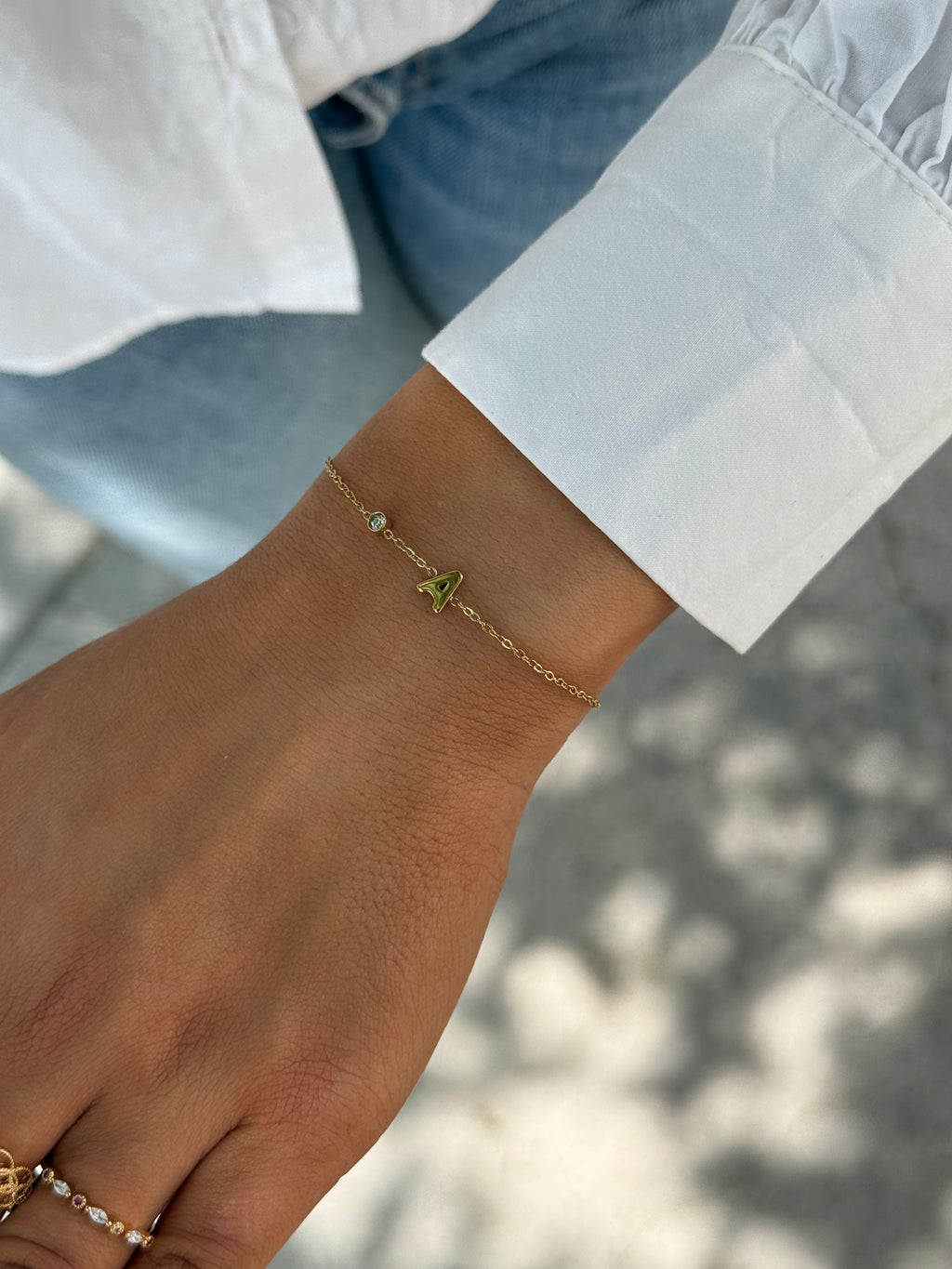 bracelet initial en acier inoxydable et strass